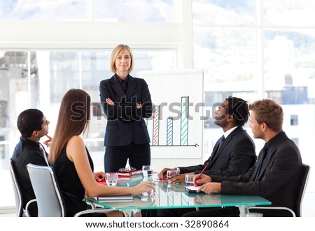 Serious businesswoman looking at the camera in a meeting