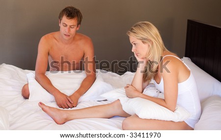 Quarrel between man and woman in bedroom