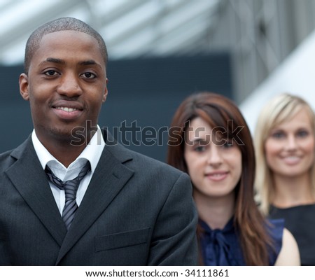 Afro-American young businessman in front of his colleagues