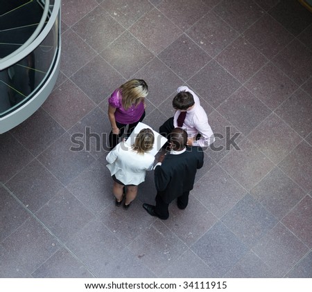 High angle of multi-ethnic businessteam interacting with each other