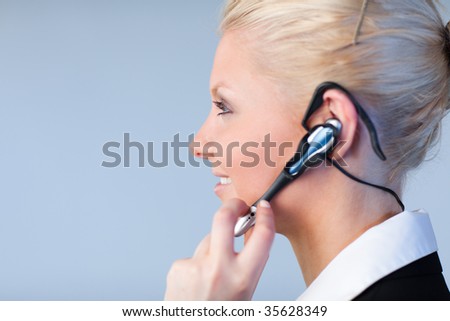 Attractive Business woman talking on a headset with copyspace and focus on the person
