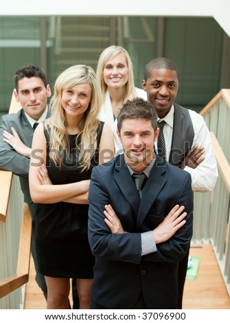 Business team in a stairs with the leader in the middle