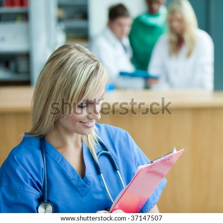 Portrait of female doctor reading some reports in hospital