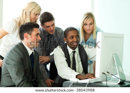 Ethnic business team working in office together