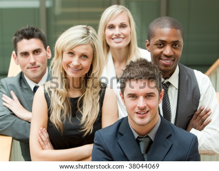 Businesspeople in a stairs with the leader in the middle