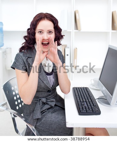 Beautiful young businesswoman yelling in office