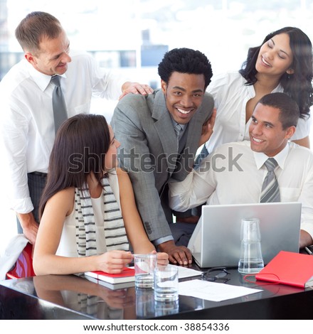 Happy multi-ethnic business team working together in office
