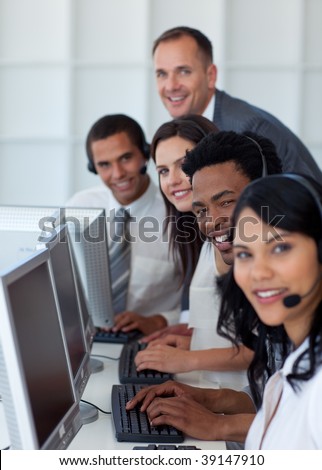 Multi-ethnic business team and manager working in a call center with a manager