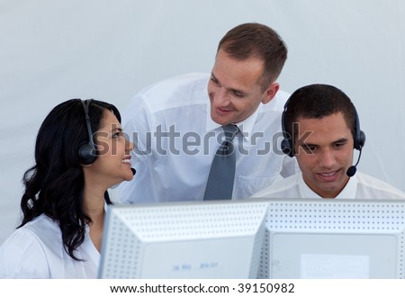 Attractive manager and business people talking  in a call canter