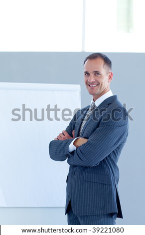 Confident businessman giving a presentation to his team