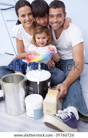 Happy family with color samples to paint new house