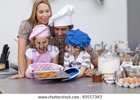 Happy family baking cookies together in the kitchen