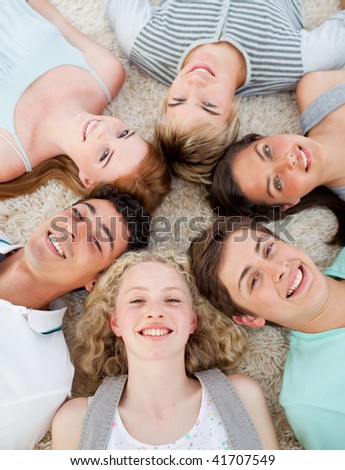 High angle of friends with their heads together smiling