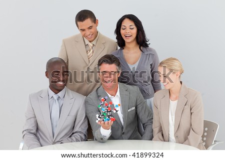 Multi-ethnic business team in a meeting between Science and Commerce