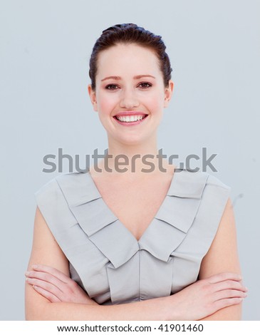 Portrait of a beautiful businesswoman with folded arms smiling at the camera