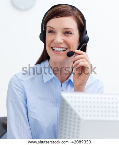 Laughing businesswoman with headset on against white background