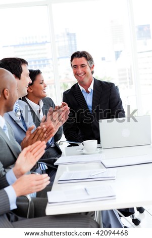 Team of successful business team applauding in a conference. Business concept.