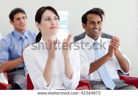 International business people clapping at a conference. Business concept.