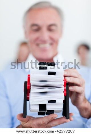 Senior manager searching for the index at his desk