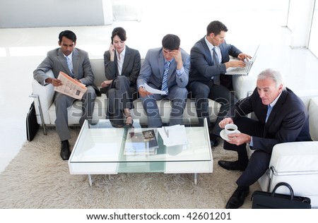 A diverse business people sitting in a waiting room. Business concept.