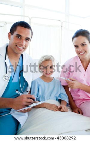 A nurse taking her patient temperature with a thermometer in a hospital