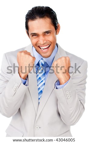 Attractive businessman punching the air celebrating a victory isolated on a white background