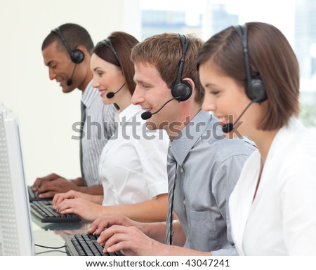 Concentrated customer service agents with headset working on in a call center