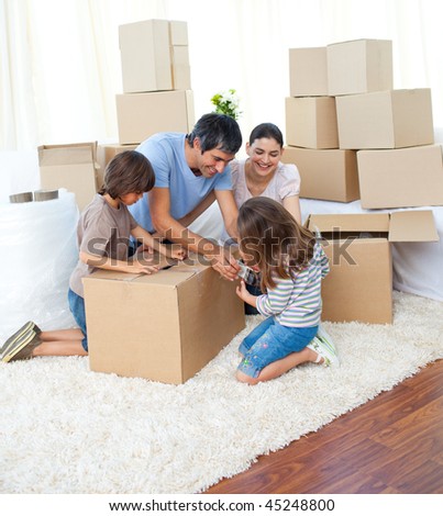 Animated family packing boxes while moving house