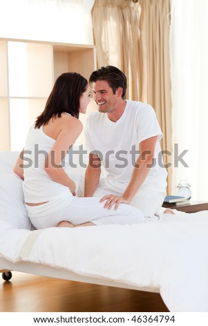 Loving couple having fun in the bedroom