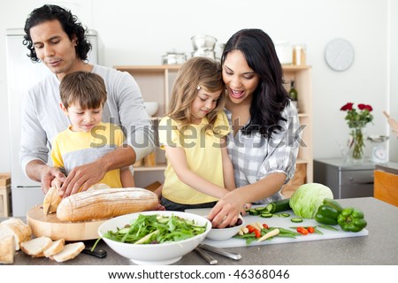 Positive family preparing lunch together in the kitchen