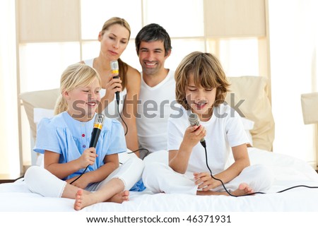 Animated family singing together sitting on bed