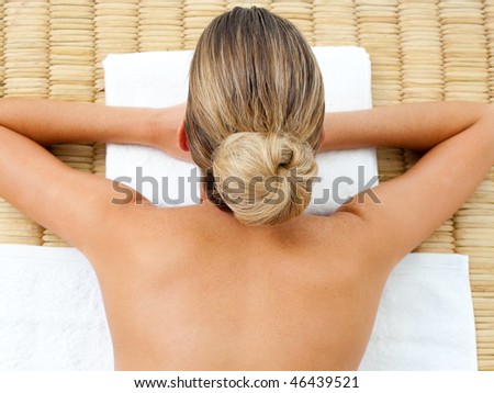 Blond woman relaxing in a spa center
