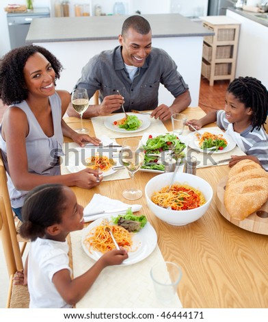 Happy family dining together in the kitchen