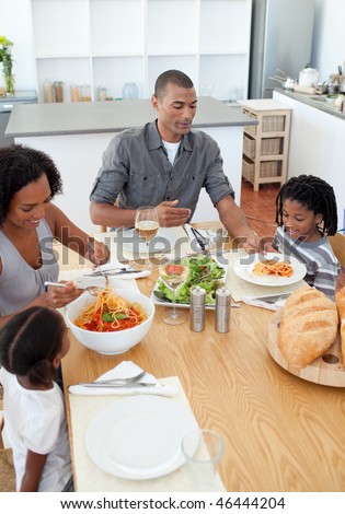 Loving family dining together in the kitchen