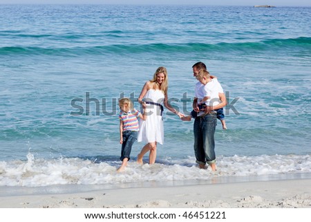 Animated family having fun on the sand at the beach