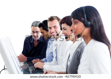 Diverse customer service representatives with headset on in a call center
