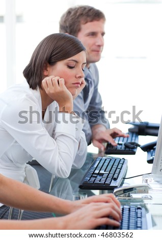 Young businesswoman getting bored at work in a company
