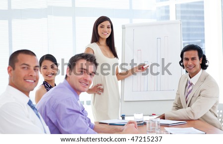 Elegant businesswoman giving a presentation to her team