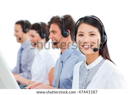 Young business people talking on headset in a call center