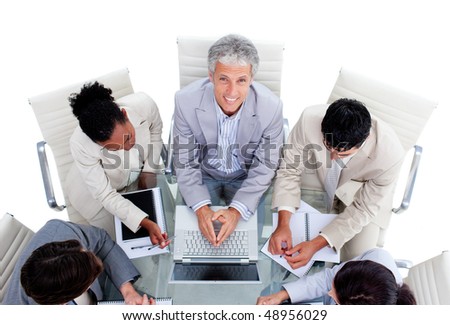 Positive international business people interacting in a meeting