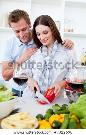 Loving couple preparing dinner in the kitchen