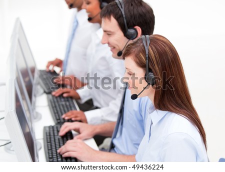 Serious customer service agents at work against  a white background