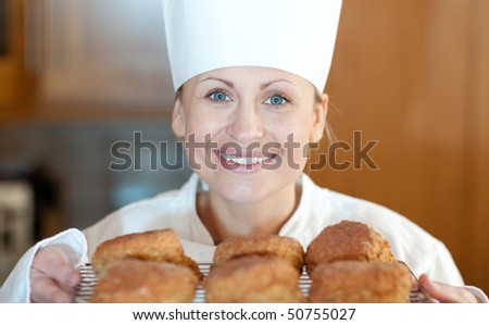 Close-up of a female chef baking scones in the kitchen