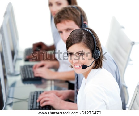 Young business team working in a call center against a white background