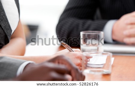 Close-up of international business people working in a meeting