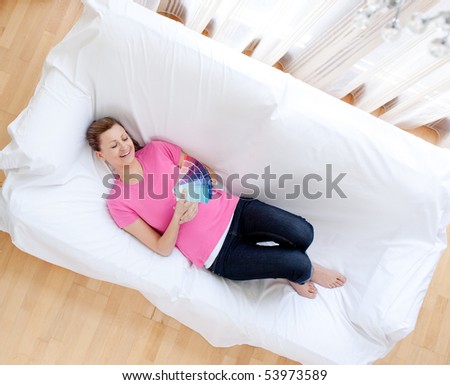 Radiant woman choosing colors to decorate her house in the living-room