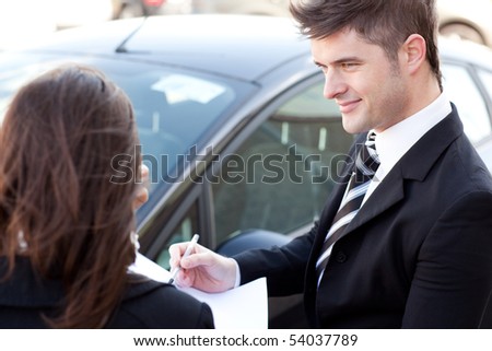 Pretty businessman meeting his colleague in the street