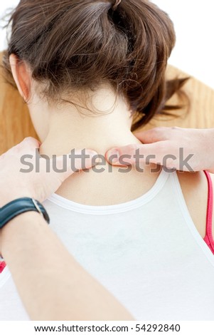 Close-up of a woman receiving a back massage in a health center