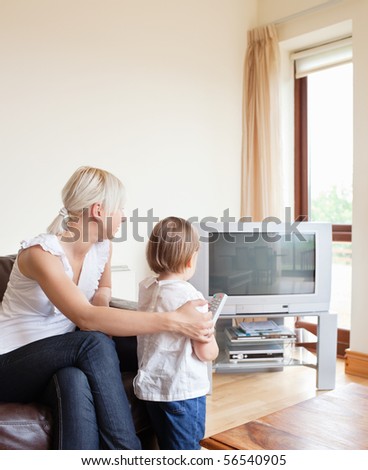 Family looking to the television in the living room