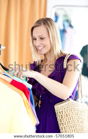 Caucasian woman is doing shopping in a clothes shop